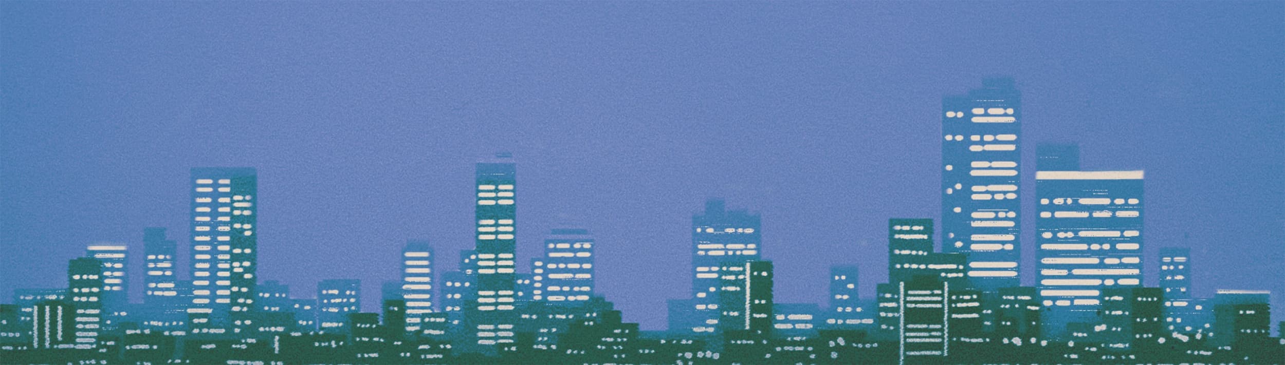Urban skyline with two tall buildings under clear blue sky
