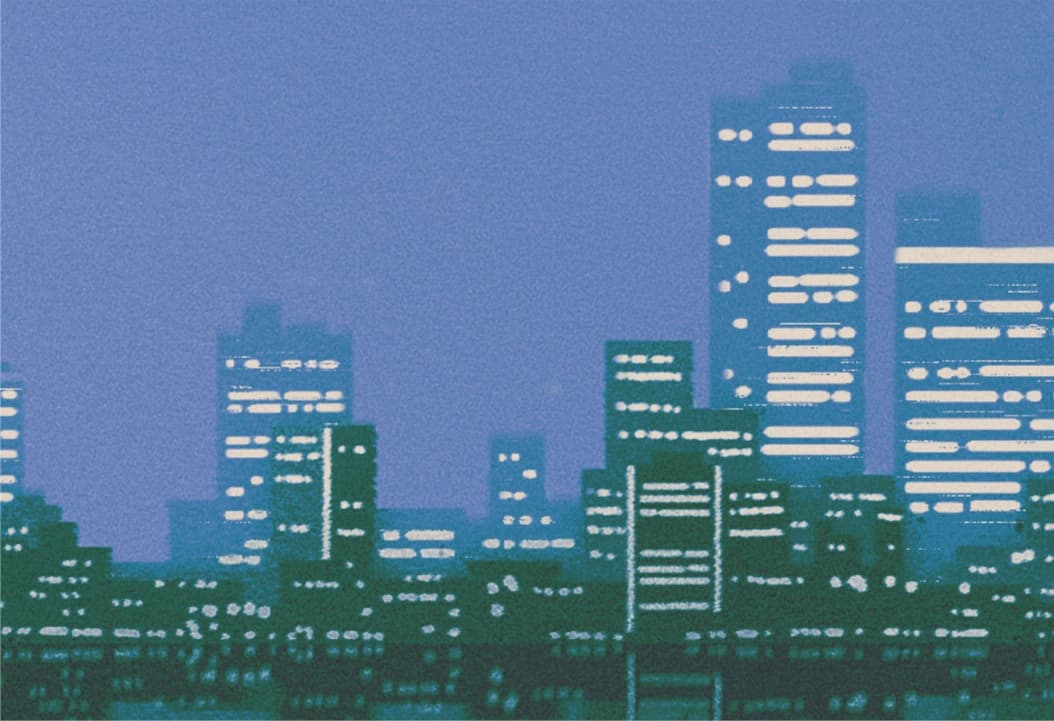 Urban skyline with two tall buildings under clear blue sky
